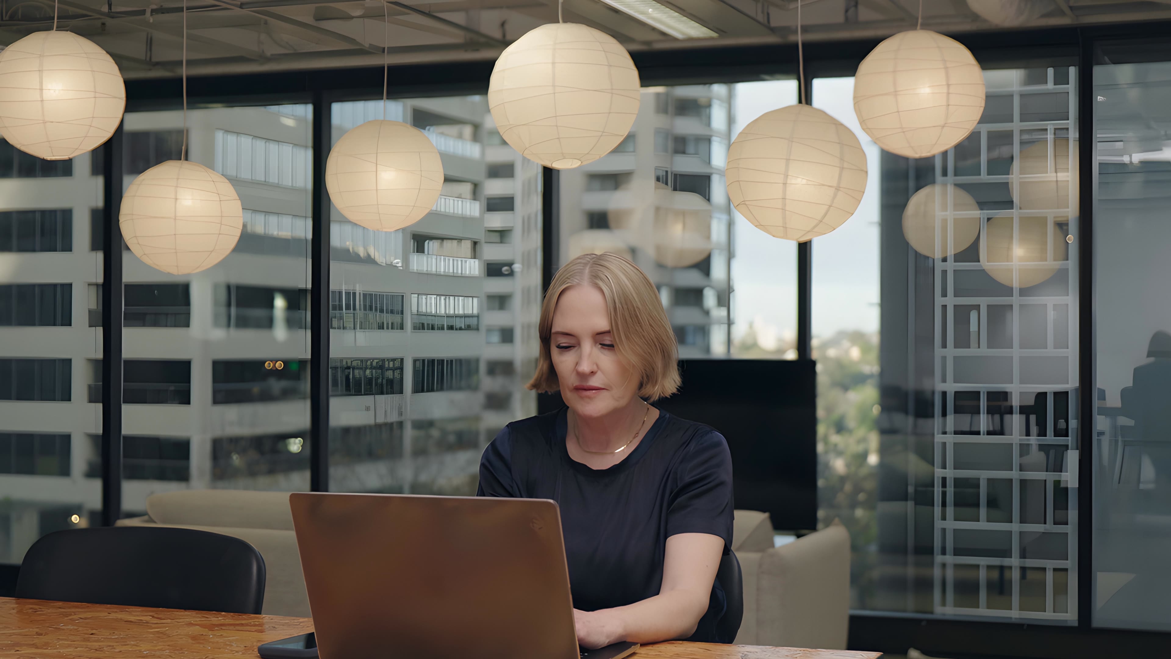 Katrina Leslie, founder of Swipejobs, working at a laptop